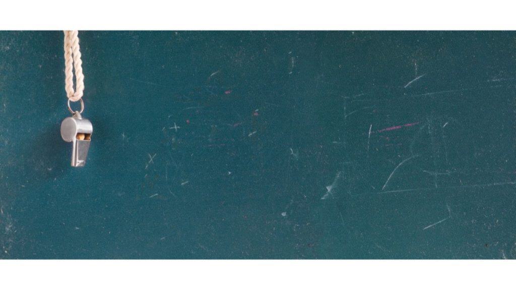 whistle hanging over chalk board